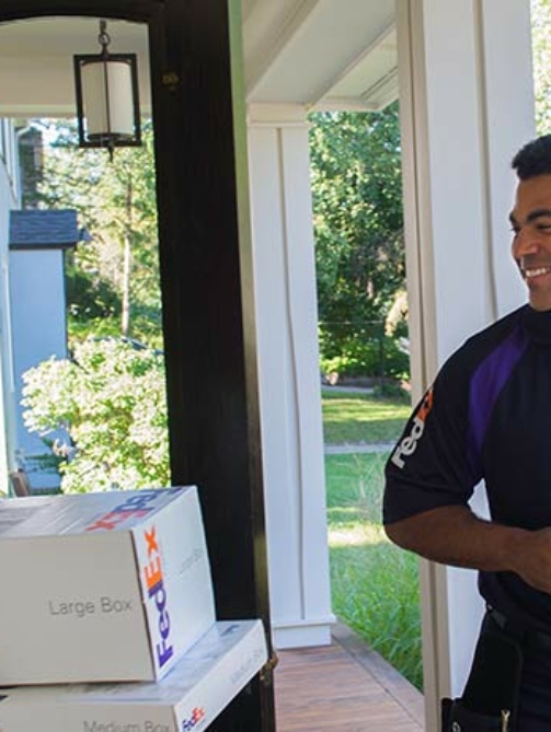 Delivery driver and woman on door step